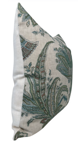Square pillow cover with detailed floral and leaf patterns in sage green, blue, and brown on a beige linen background with a plain light beige back panel.