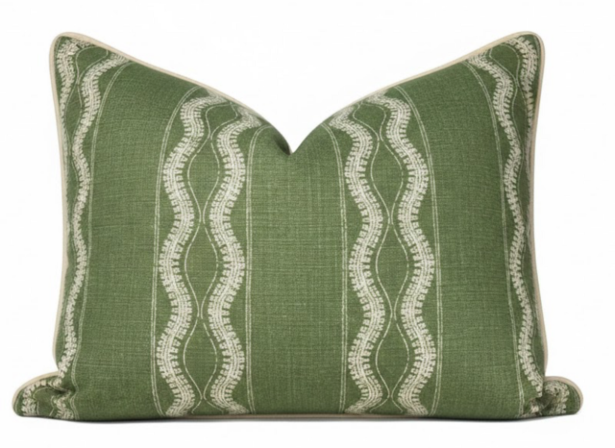 Rectangular green pillow cover with vertical white wavy and stitched stripe patterns and beige piping along edges.