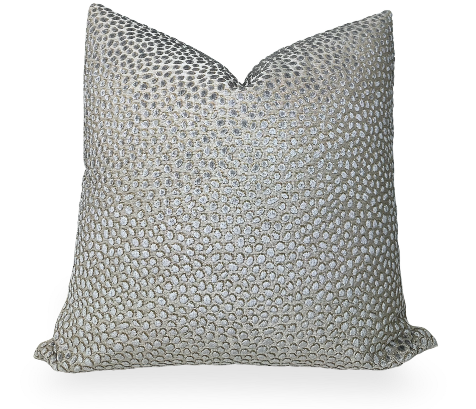 Grey velvet pillow cover with beige linen back folded on a chair
