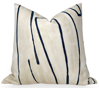 Graffito Pillow Cover in Ivory Linen Onyx photographed with abstract patterns on linen fabric