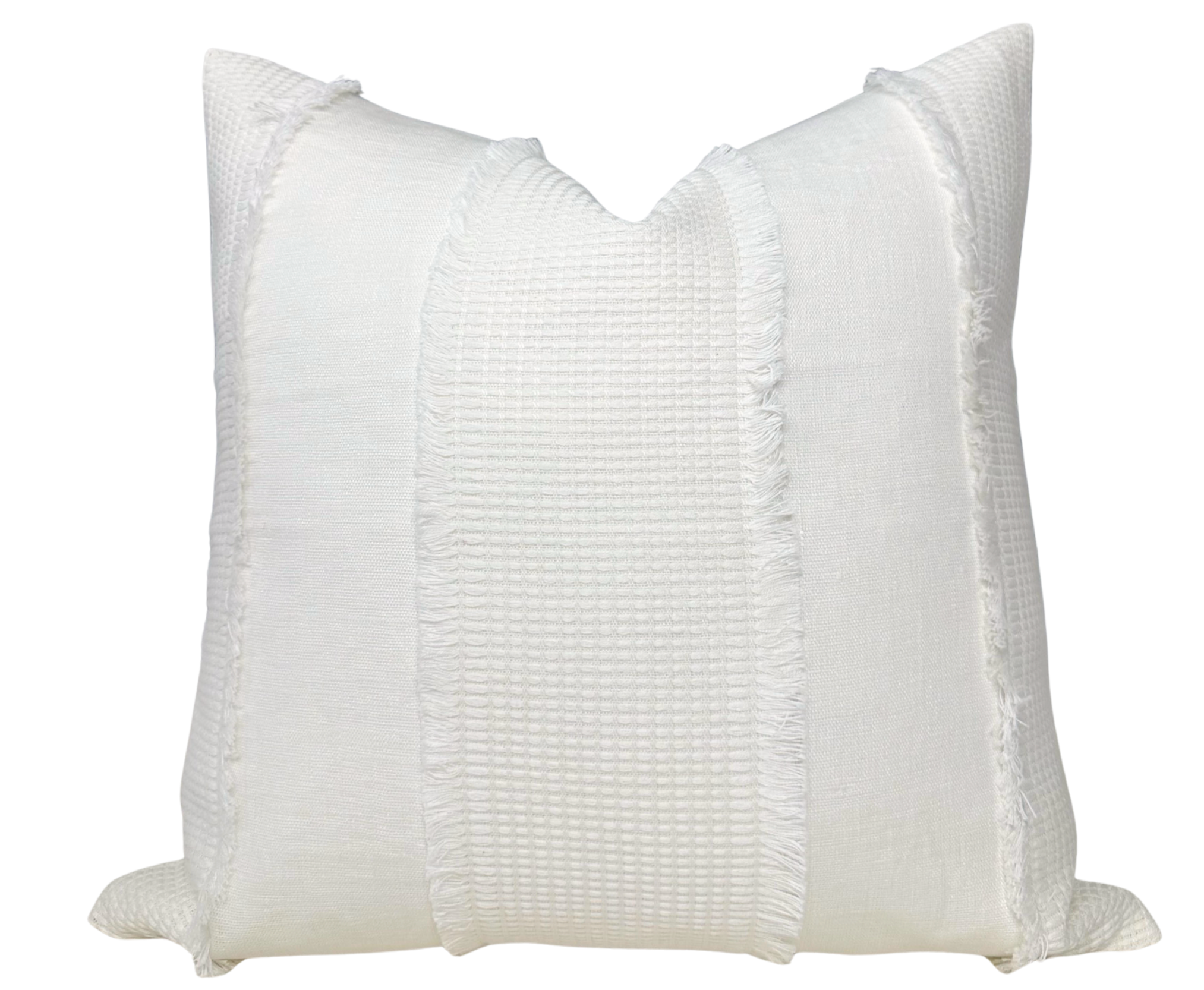 Tulum Casement Embroidered Pillow Cover in Ivory displayed on a sofa