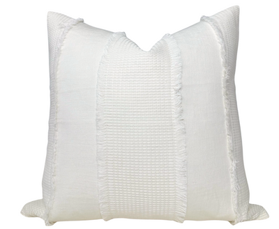 Tulum Casement Embroidered Pillow Cover in Ivory displayed on a sofa
