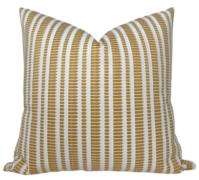 Oyo Pillow Cover in mustard yellow with ivory linen backing, styled on a sofa