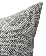Close-up of the On the Lamb Woven Pillow Cover in Platinum showing dense gray and white looped woven fabric with textured raised dots.