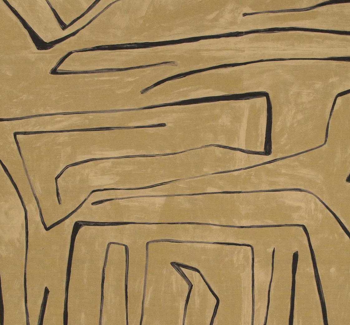 Abstract geometric pattern in black lines on a textured warm tan background, forming irregular angular shapes across the fabric surface.