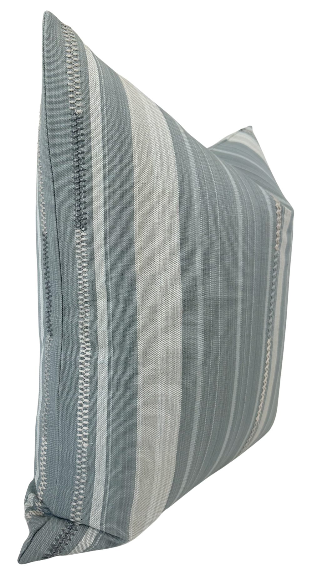 Square pillow with vertical grey and off-white stripes and subtle woven geometric accents, shown at an angle against a white background.
