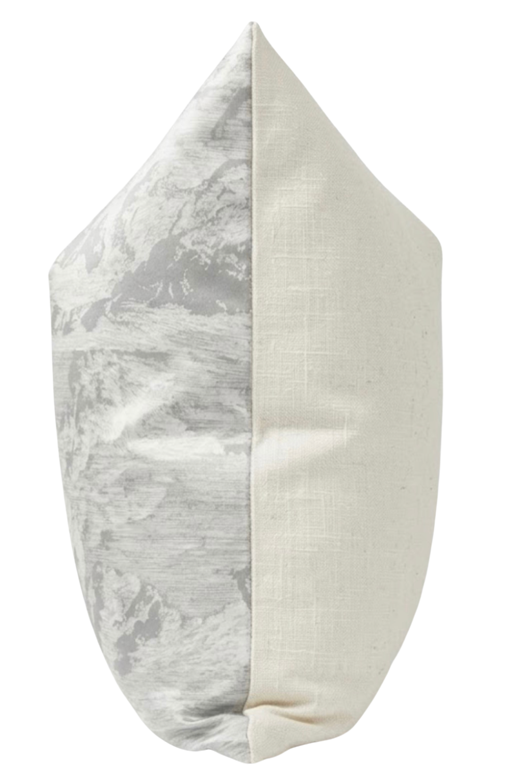 Pillow with one side featuring a subtle grey cloud-like toile pattern and the other side a solid off-white fabric, shown standing on its corner.