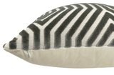 Close-up of a rectangular pillow with a black and white chevron pattern on top and a solid light grey back side, featuring a small zipper along the seam.