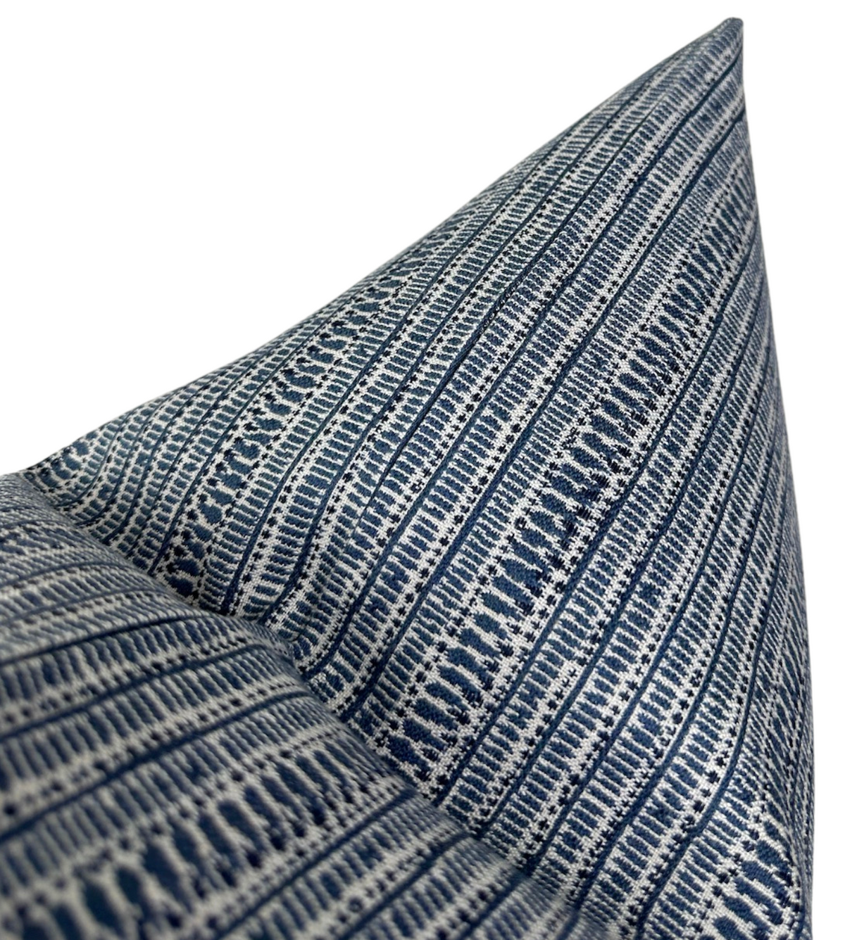 Close-up of Saqqara Pillow Cover featuring tight vertical stripes in varied Atlantic Blue patterns on a white background, highlighting fabric texture and sharp corner.