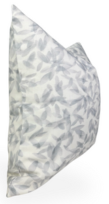 Square pillow cover with a soft gray leaf pattern on a white background, shown from a side angle emphasizing its plush texture and subtle botanical design.