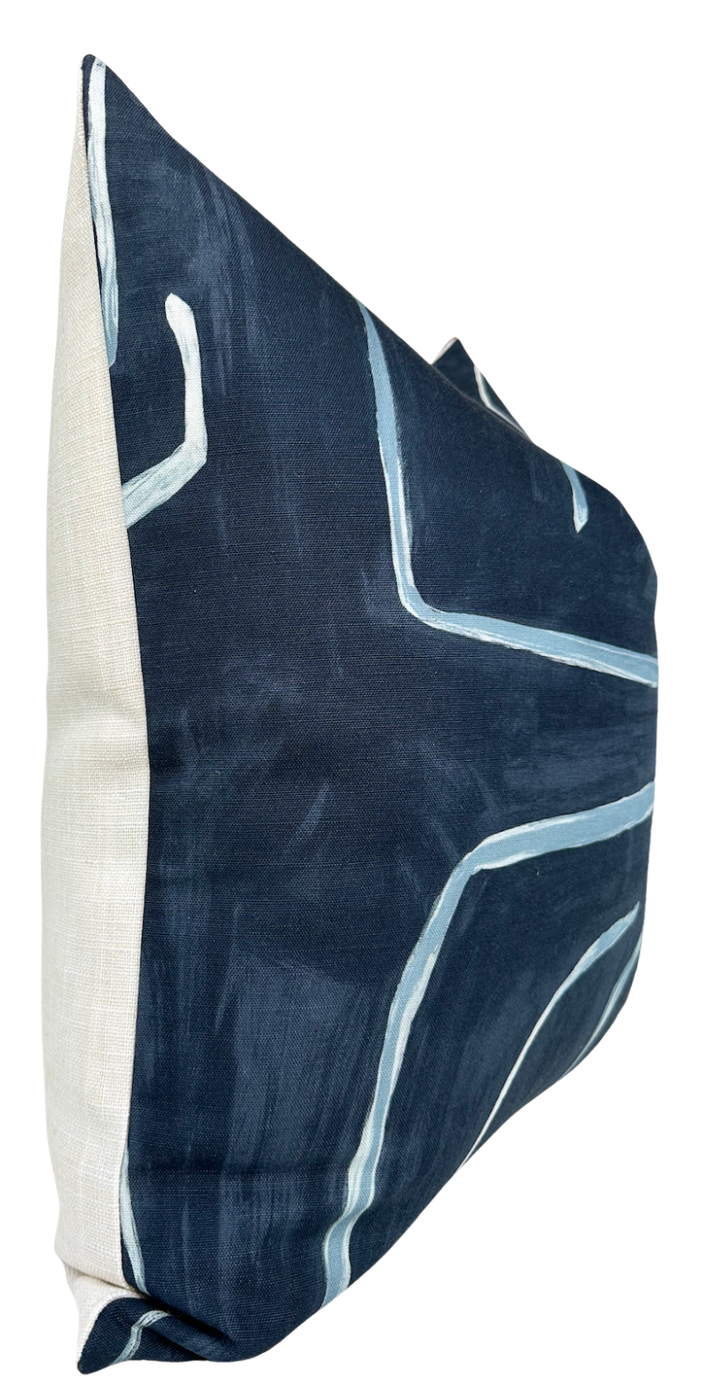 Square pillow with navy blue cover featuring abstract white and light blue linear graffiti patterns and a plain light beige back panel.