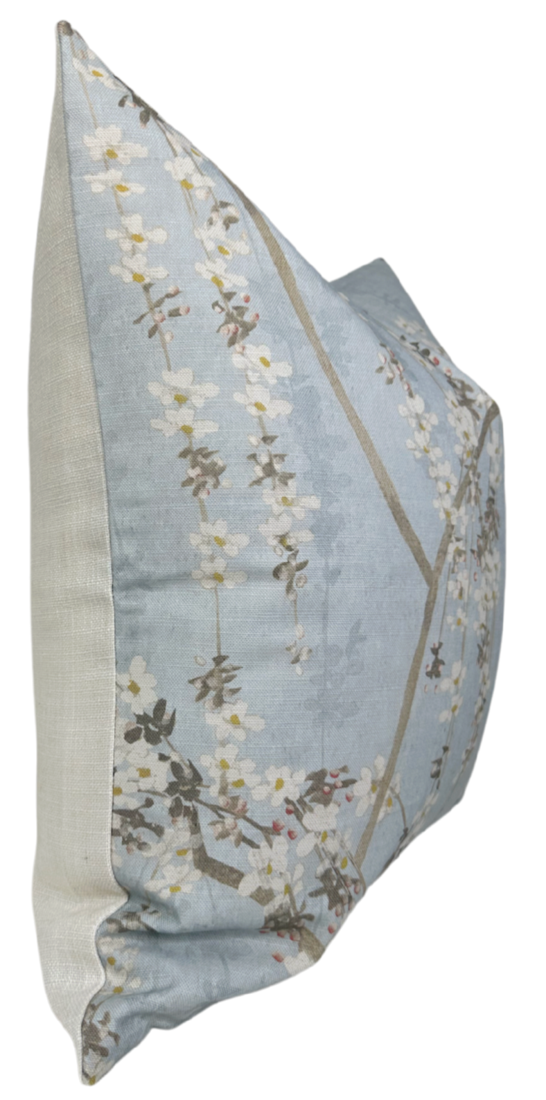 Rectangular pillow with a light blue front featuring white and brown weeping blossom floral patterns and solid beige fabric on the sides, shown at an angle.
