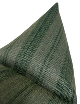 Close-up of a woven pillow cover featuring forest green and dark green vertical stripes with a textured fabric pattern.