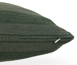 Close-up of a forest green striped woven pillow cover showing textured fabric and a small white zipper on the side for closure.