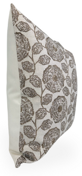 Square pillow cover with sepia-toned floral pattern of large circular flowers and attached leaves on a neutral background, shown from an angled side view.