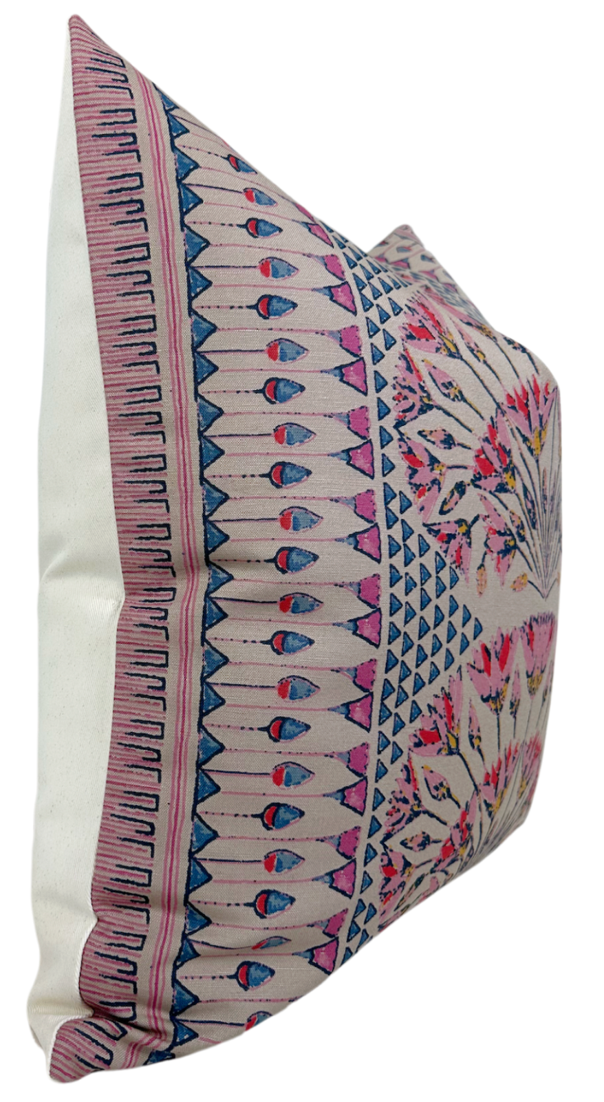 Square pillow with intricate pink and coral geometric and floral patterns on a cream background, featuring blue accents and a white fabric side panel.