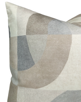 Pillow cover with abstract geometric pattern in soft parchment tones, featuring overlapping curved shapes in beige, gray, and muted blue shades.