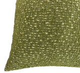 Close-up of Serra pillow cover in textured chive green fabric with looped yarn details creating a tactile, intricate pattern.