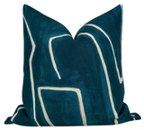 Graffito Pillow Cover in Teal Pearl displayed on couch with teal abstract pattern and ivory linen backside