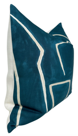 Square pillow cover with deep teal velvet front featuring cream-colored abstract linear patterns and plain off-white fabric on the back and sides.