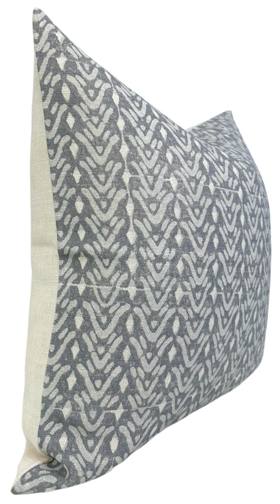 Rectangular pillow cover featuring a gray and white abstract bellflower pattern on the front with a solid off-white fabric on the side.