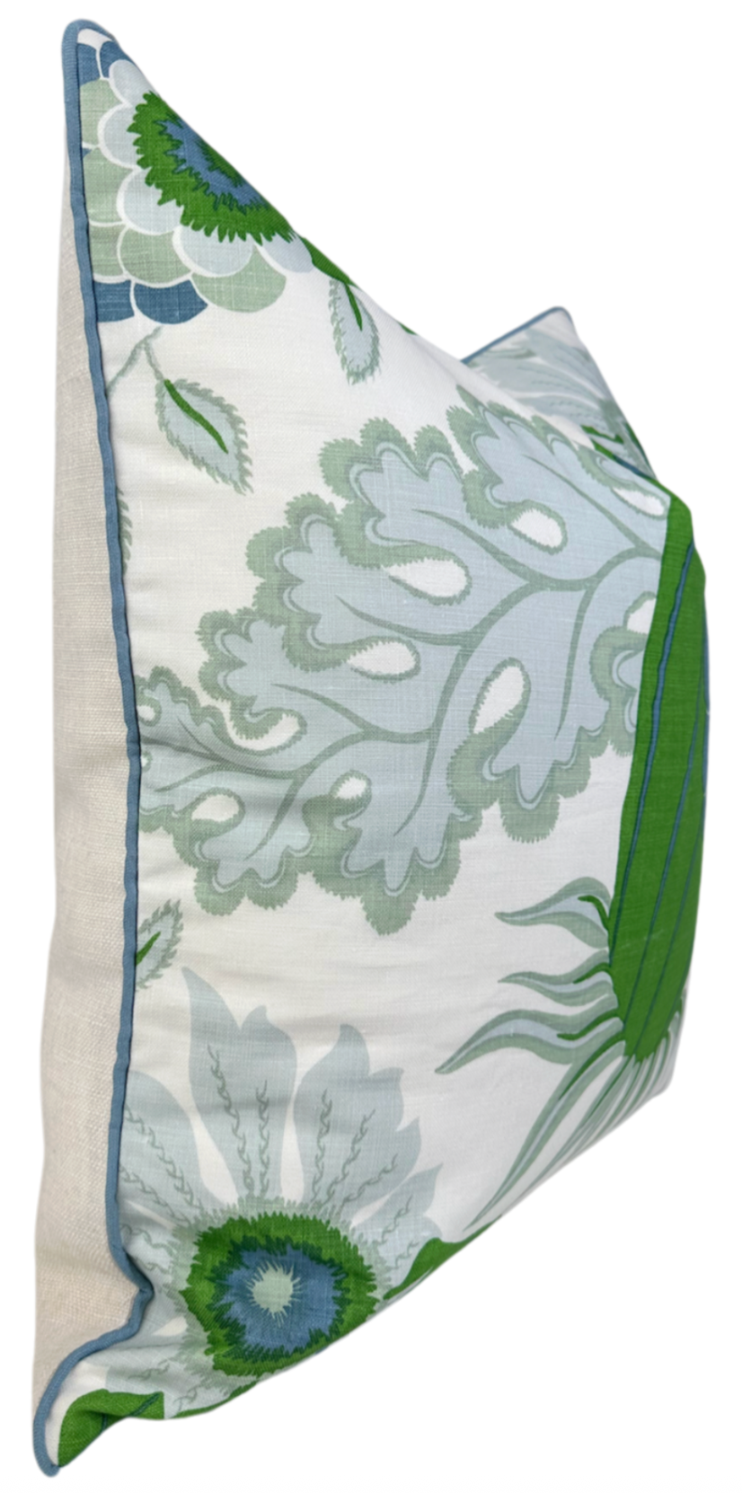 Rectangular pillow with pale blue and green botanical print, outlined by a slim blue border and a wider green edge, shown from a side angle.