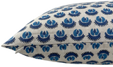 Close-up of a beige pillow cover with a repeating blue circular floral pattern and a visible concealed zipper along the edge.