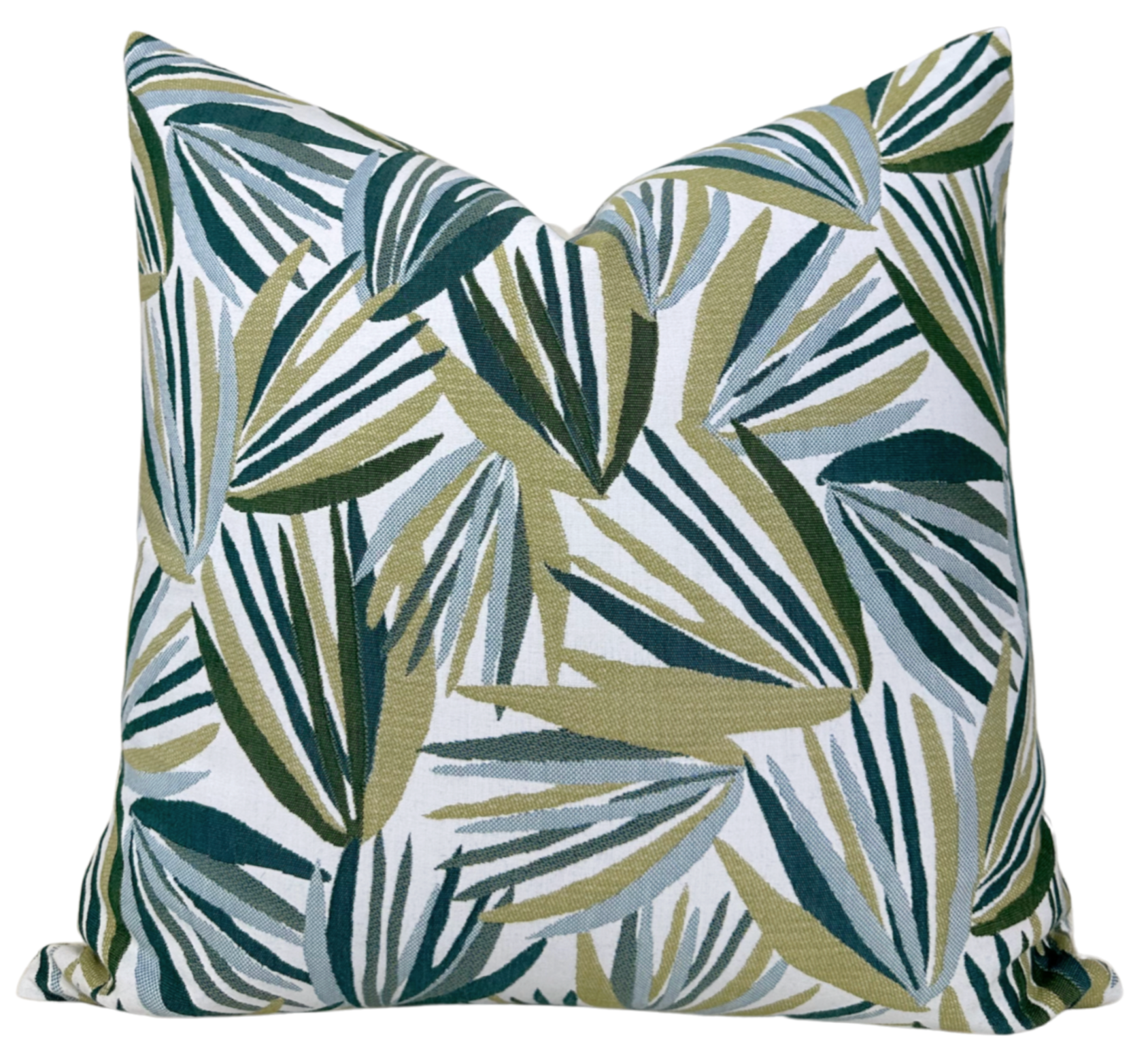 Palmetto Pillow Cover in verdigris green displayed on a white sofa with visible woven texture