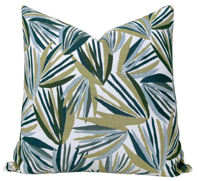 Palmetto Pillow Cover in verdigris green displayed on a white sofa with visible woven texture