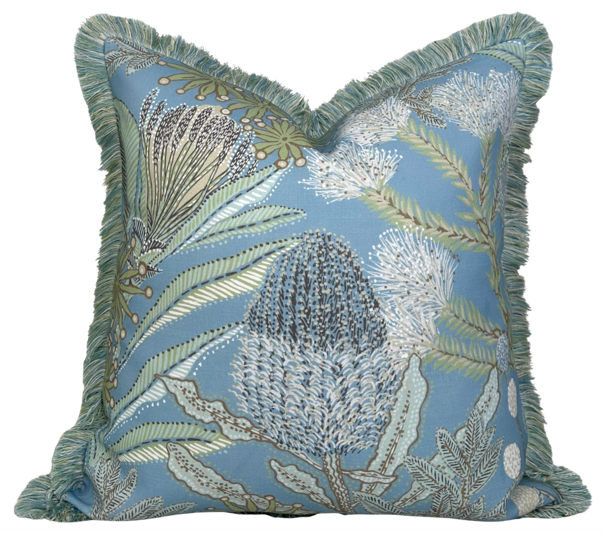 Square pillow cover with spa blue background, featuring detailed botanical protea flowers and green leaves, edged with soft green fringe trim.