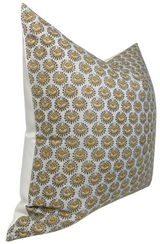 Square pillow cover with repeating saffron-colored eye motif on white background, featuring detailed golden-yellow and gray accents.