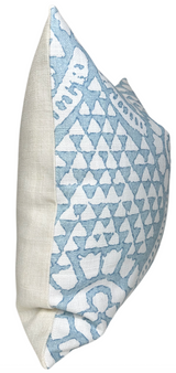 Square pillow with a white linen back and front featuring a raised chamomile-inspired pattern in soft spa blue and white tones.