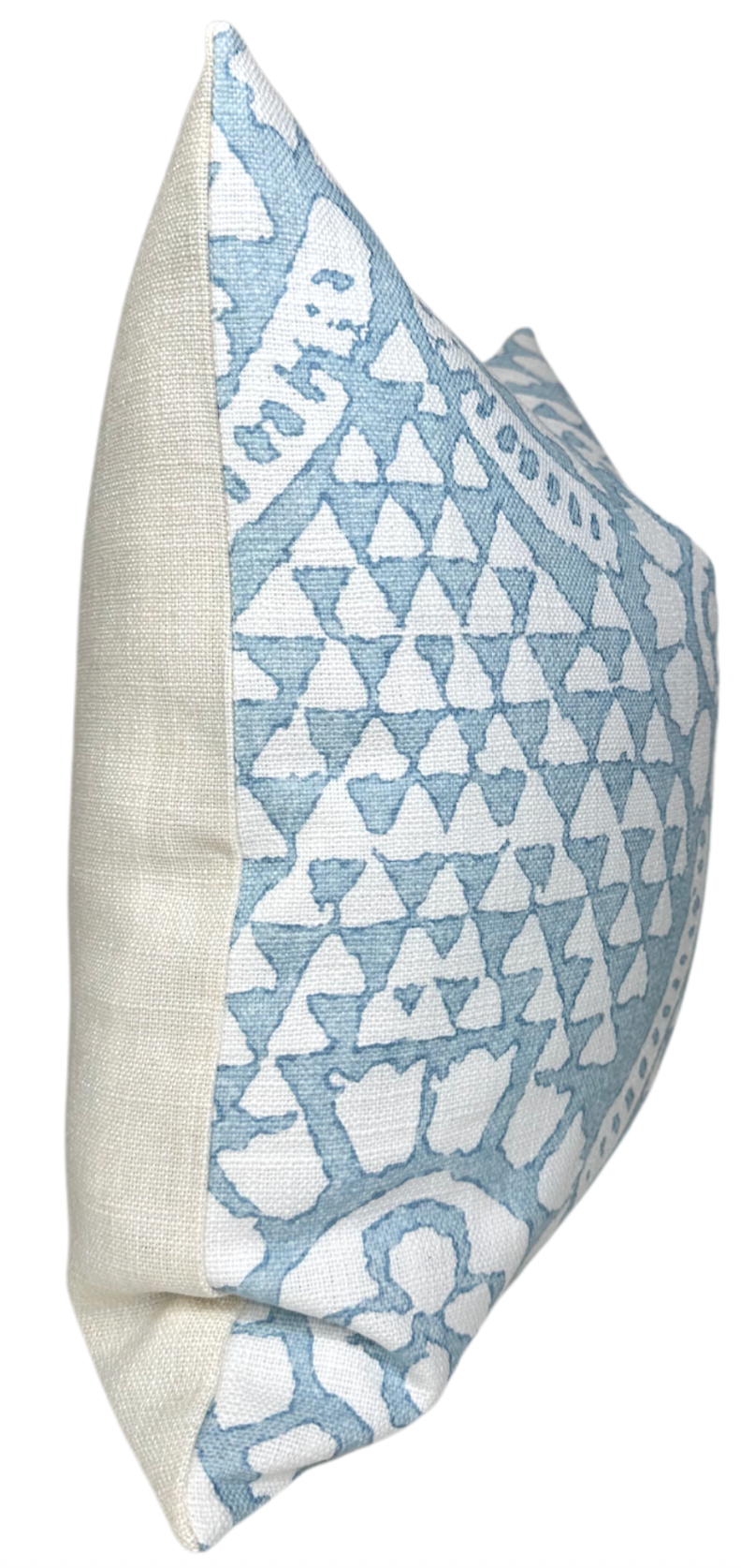 Square pillow with a white linen back and front featuring a raised chamomile-inspired pattern in soft spa blue and white tones.