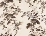 Floral fabric with charcoal-colored hollyhock flowers and leaves on a cream background, featuring detailed botanical patterns in grayscale tones.