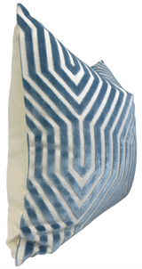 Square pillow with marine blue velvet geometric chevron pattern on front and cream fabric on sides, shown in angled side view.