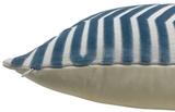 Close-up of a rectangular pillow with a marine blue velvet geometric stripe pattern on top and smooth beige fabric on the bottom, featuring a small white zipper on the side.