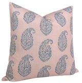 Square pink pillow cover patterned with evenly spaced blue paisley motifs, displayed with a slightly slanted front view.