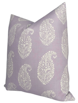 Square pillow cover in lilac purple featuring a repeating pattern of white, intricately detailed paisley motifs arranged evenly across the fabric.