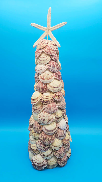 Handmade 18.75 inch scallop shell Christmas tree with natural starfish topper on blue background