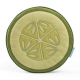 Round cushion designed like a cucumber slice with light green center showing seed patterns and a darker green outer ring.
