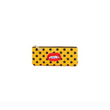 Yellow rectangular pencil case with evenly spaced black polka dots and an embroidered red lip patch showing teeth with the word 'SHUT' inside