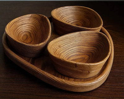 Set of handcrafted wooden nut bowls with tray showing natural wood grain and sandblasted texture