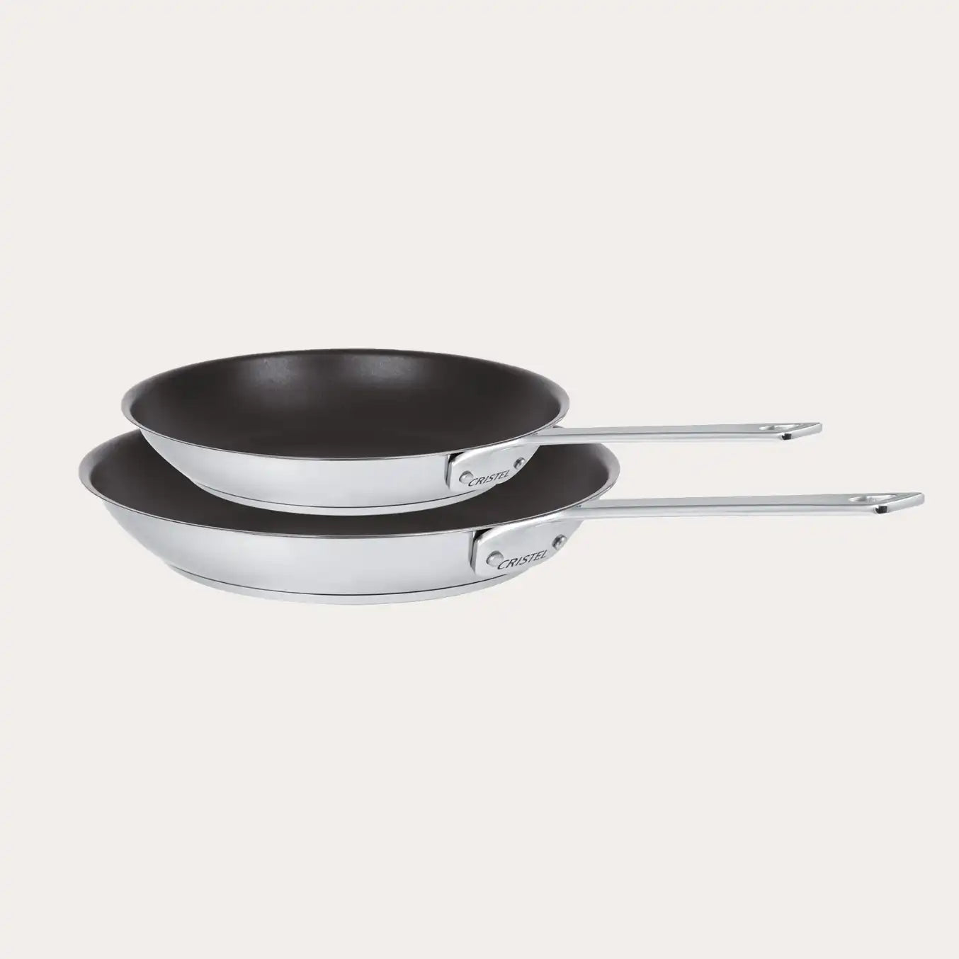 Set of two CRISTEL USA non-stick frying pans, one 8 inch and one 10 inch, on white background