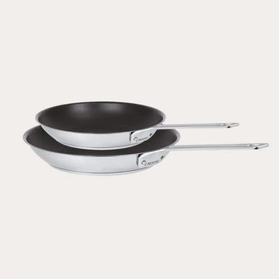 Set of two CRISTEL USA non-stick frying pans, one 8 inch and one 10 inch, on white background