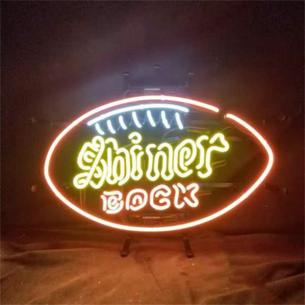 Shiner Bock Beer Neon Sign Light glowing on a wall with metal grid backing