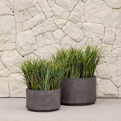 Shoob planter in white with round smooth cylindrical shape elevating greenery