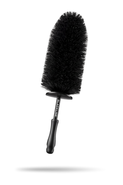BLACKLINE® Wheel Barrel Brush showing flexible bristles and ergonomic handle for deep cleaning vehicle wheels