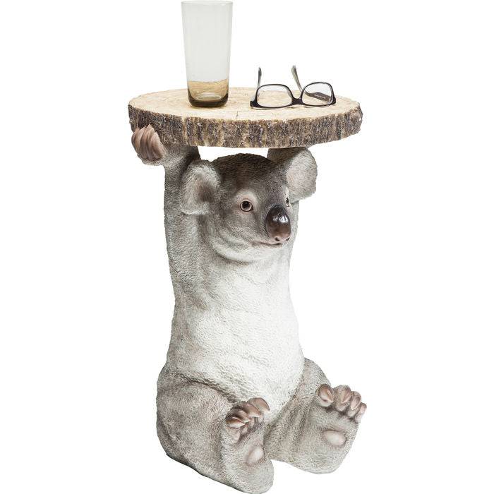Side table with a detailed koala figure holding a round wood-slice tabletop, featuring realistic gray fur texture and small ears, holding a glass and glasses on top
