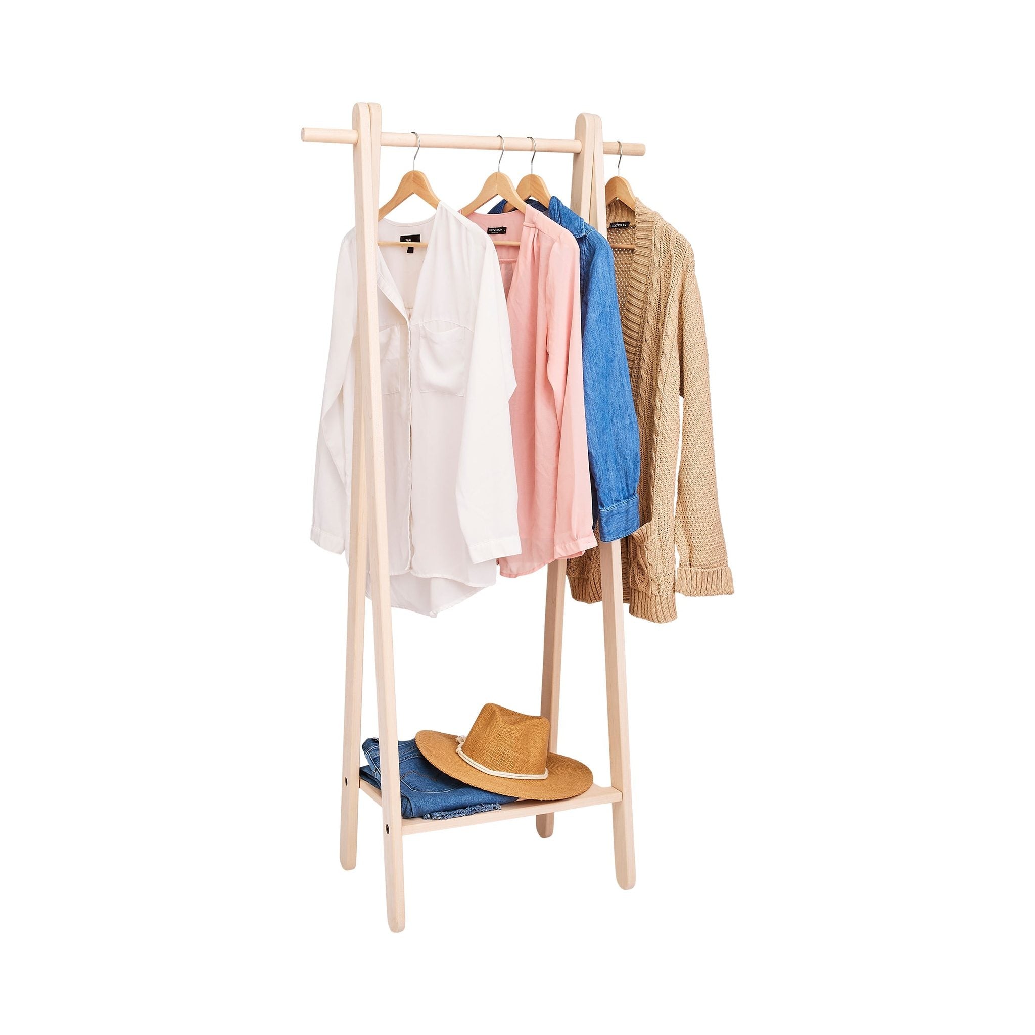Handcrafted wooden garment rack holding clothes and coats in a home setting