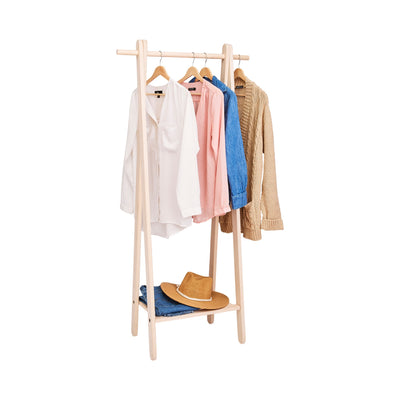 Handcrafted wooden garment rack holding clothes and coats in a home setting